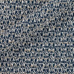 White and blue tweed alternating threads forming a soft grid with metallic reflections.